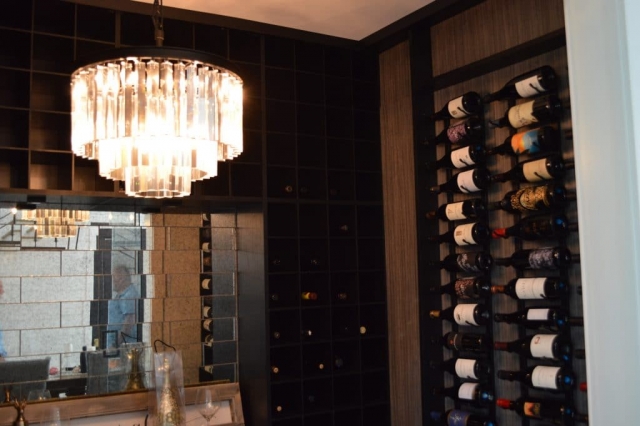glass wine cellar with chandelier in orange county