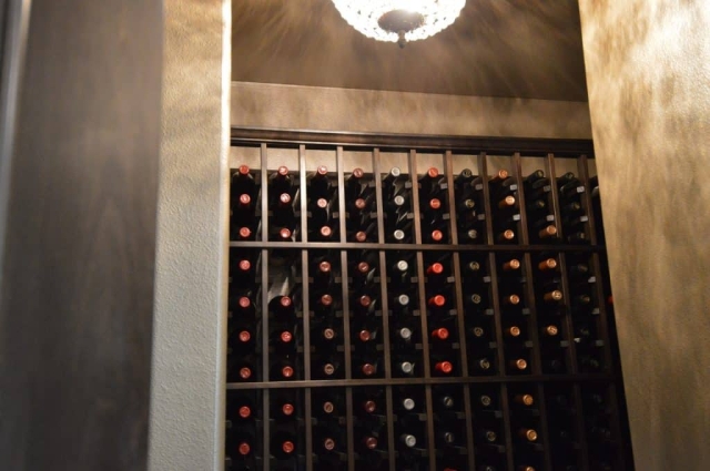 Only one ceiling light was used to make this small pantry wine cellar.